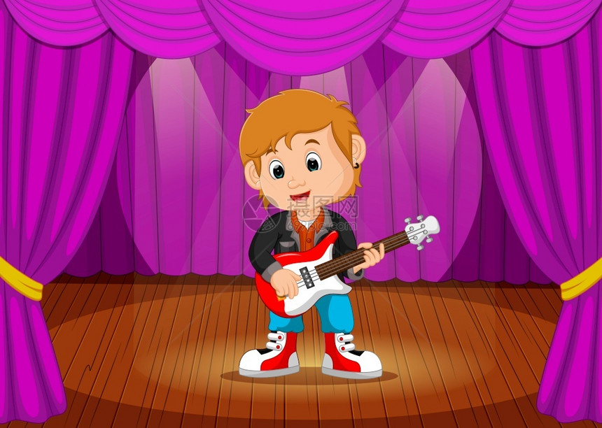 在舞台上玩电吉他的小男孩图片