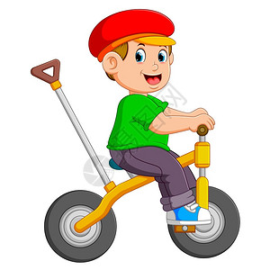 男孩骑着黄色自行车图片