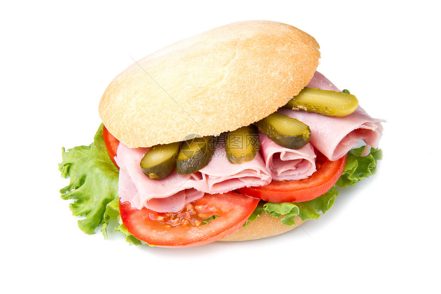 白背景的火腿三明治和蔬菜图片