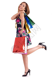 可爱的女子喜欢购物用白色背景的手拿着包图片
