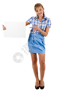 商业女人在室内工作的空白板上持有和指点图片