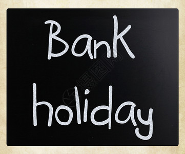 银行假日手写白色粉笔在黑板上礼物高清图片素材