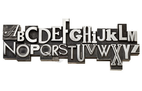 两行的旧金属类型英文字母各种体以白色隔开背景图片