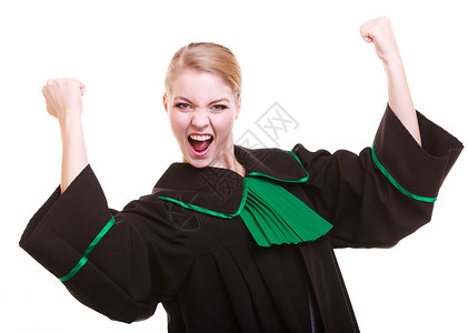 年轻女律师身着经典油波兰黑色绿礼服庆祝成功胜利图片