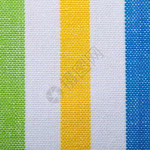 彩色绿黄垂直条纹织物作为背景纹理或图案宏图片