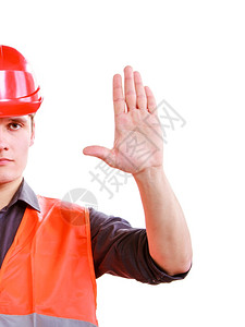 建筑工人长中一部分穿着橙色安全背心和红硬帽手势停止孤立在白色上工业作没有安全进入工作室中射击高清图片素材