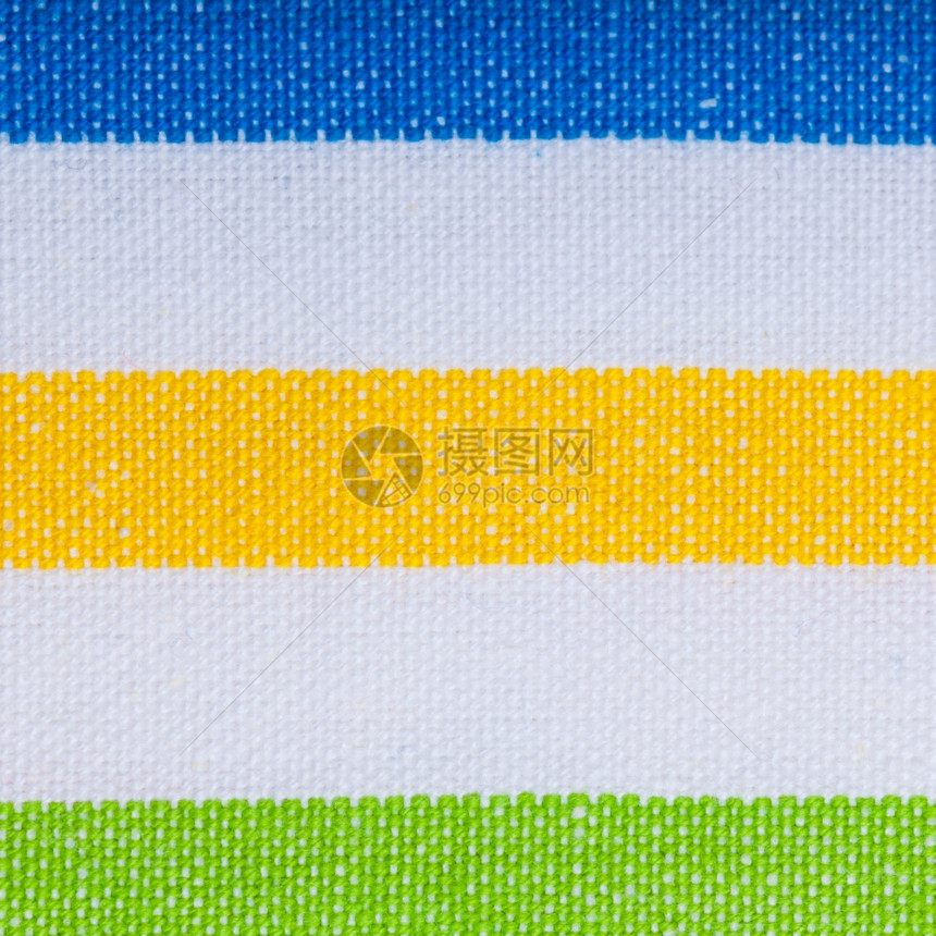 彩色绿黄蓝横向条纹织物作为背景纹理或图案宏图片
