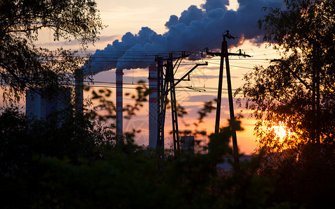 煤改电日落时电厂或站烟囱雾工业景观背景