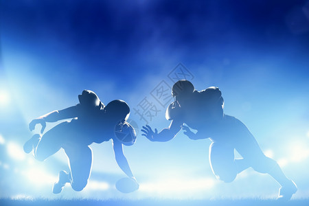 美国足球运动员在比赛中触地得分夜球场灯光高清图片