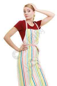 穿着脱条厨房围裙的有趣家庭主妇或小商业拥有者店主企业家助理图片