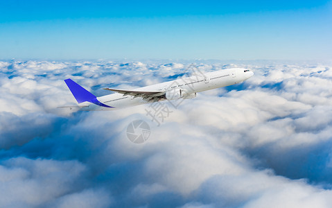 蓝色空中客机飞行蓝色的客机在云层中飞行技术高清图片素材
