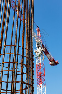 建筑工地钢铁加固建筑起重机背景图片