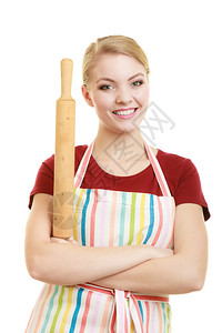 手持木棍的女人穿着厨房围裙的快乐家庭主妇或面包师厨穿着房围裙手持白色孤立的滚针工作室照片背景
