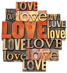爱情字抽象词由彩色墨水染的多种字体由旧式纸印木型刷板打块中文本的孤立拼贴图片