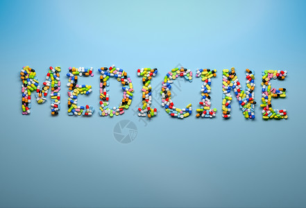 医药和保健概念用蓝底胶囊和药丸拼写成单词的医药图片
