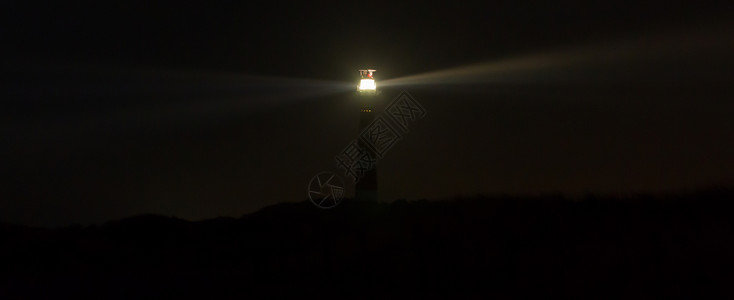 灯塔在荷兰阿梅湾暗的荷达特奇岛灯塔供文字用的房间图片