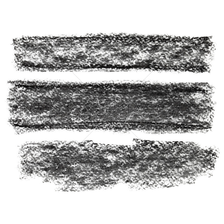 白色背景上隔离的一组黑色纸质木炭条图片