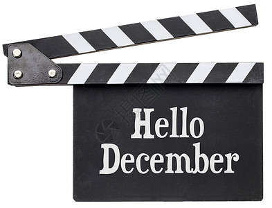 你好12月电影标题白粉钟板上的纸笔孤立在板上背景图片