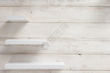 白色木板背景纹理上的木架图片