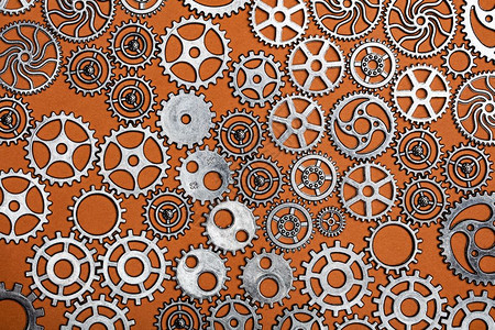 橙色背景的一帮科格轮机械部件工业概念橙色背景的科格轮工业概念图片