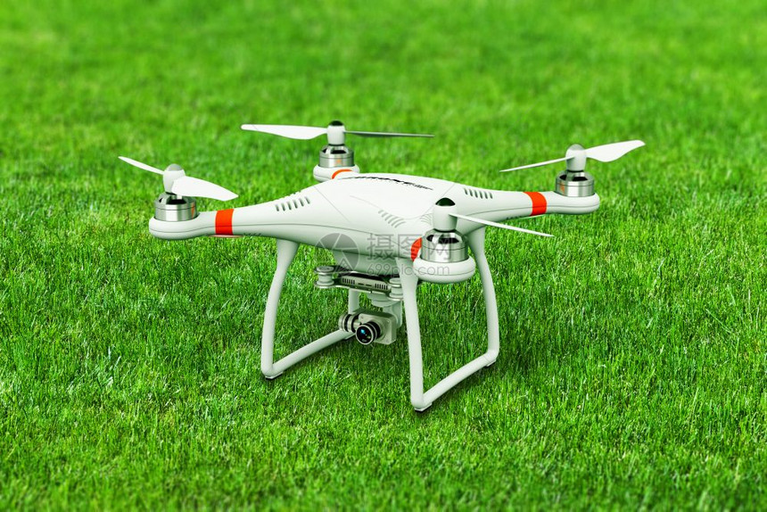 无人机在绿色草地进行空中摄影图片
