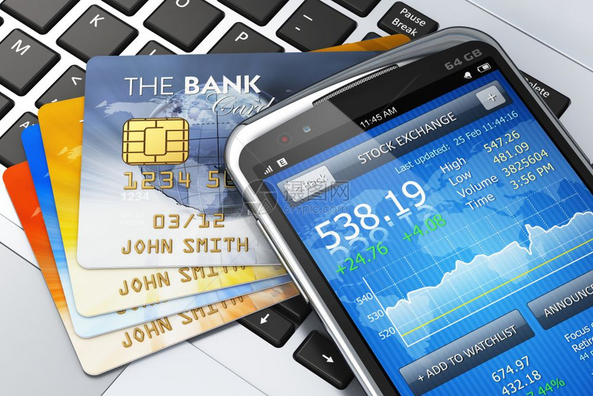 移动银行金融和创造货币概念黑色现代触摸屏智能手机具有证券交易所市场应用和笔记本键盘信用卡组合图片