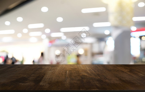 合您口味毛笔字在餐厅的抽象模糊布基背景面前的空暗黑木桌可以用于显示或蒙合您的产品背景