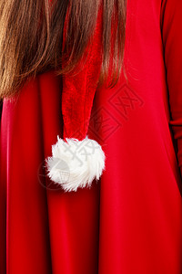 圣诞时间穿着礼帽红服和西装背景的特紧身女郎图片