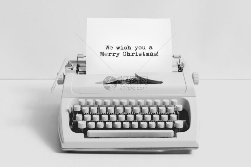 圣诞祝词写在白色背景的旧打字机上圣诞祝词写在旧打字机上图片