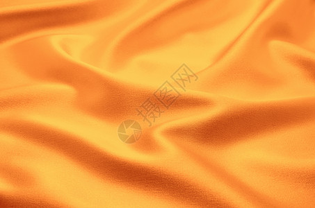 橙色布美丽的布背景背景