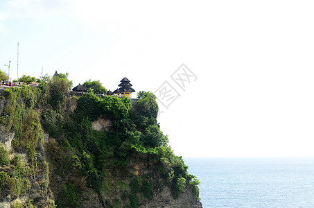 莫赫尔悬崖印度尼西亚巴厘的PuraLuhurUluwatu寺庙背景