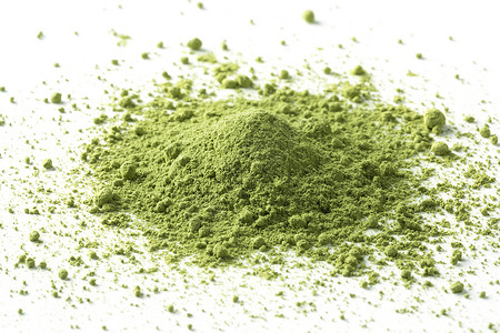 绿色的日本火辣茶粉堆成绿色的日本火辣茶粉背景图片