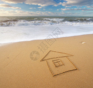 海洋和家园在沙上自然和概念构成图片