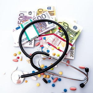 医用药丸欧元货币背景的听器健康的高清图片素材