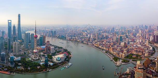黄浦河HuangpuRiver上海市摩天大楼和高办公的空中景象日出时金融区和亚洲智能城市的商业中心社区高清图片素材