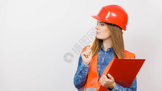 妇女建筑工人结构程师穿橙色背心红硬头盔佩戴钢笔文件垫工业作安全室中戴头盔的女工程师建筑商业高清图片素材