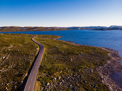 空中观察穿过挪威Hardangervidda高原挪威地貌旅游者Hardangervidda路线穿过挪威Hardangervidd景观高清图片素材