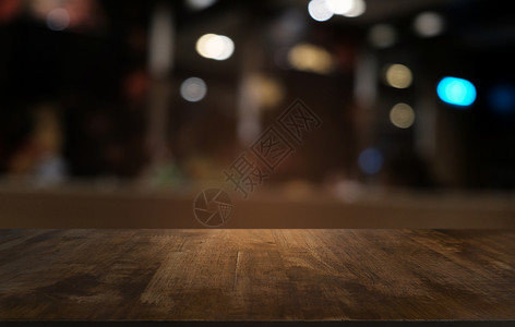 合您口味毛笔字在餐厅的抽象模糊布基背景面前的空暗黑木桌可以用于显示或蒙合您的产品背景