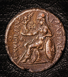 深黑背景的古希腊硬币四色旧希腊背景图片