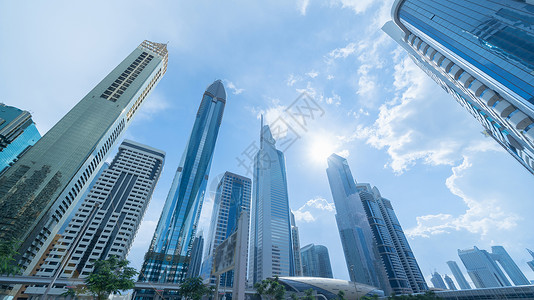 寻找高楼办公摩天大有蓝色空的金融区建筑阿联酋迪拜市中心城商业和技术概念背景智能城市现代的高清图片素材