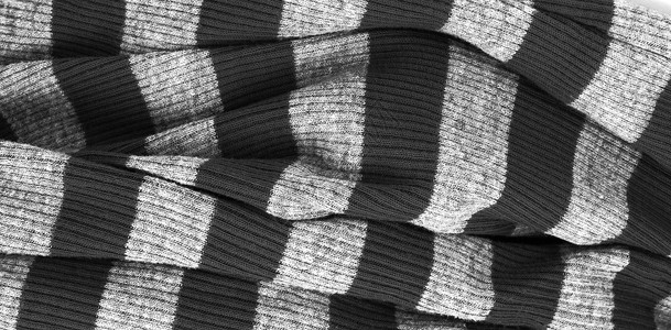 灰色的布黑色和白条纹温暖毛衣编织的布水平背景背景
