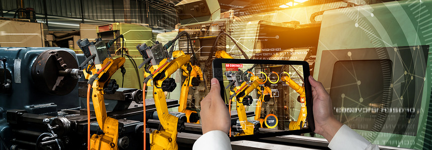工程师通过扩大现实工业技术应用软件来控制机器人武未来工厂的智能机器人在工业40或第次工业革命的概念下运作图片
