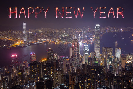新年快乐的烟花在香港市夜间欢庆港湾高清图片素材