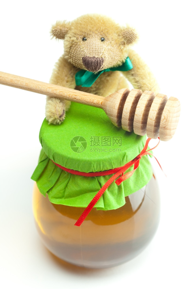 泰迪熊棍棒对霍海和一罐蜂蜜孤立在白色图片
