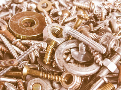 工业钢硬件螺栓坚果作为背景古董的螺丝图片