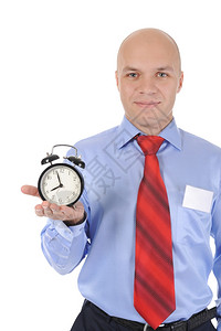 一个人手拿着闹钟孤立在白色背景上图片