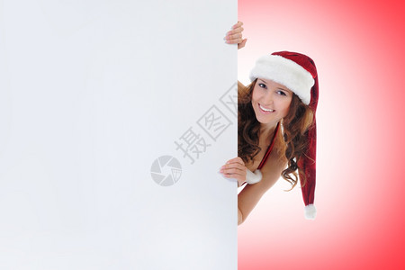 圣诞微笑的女人红色圣塔帽背景图片