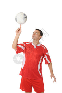 足球运动员用指环旋转球孤立于白色背景图片