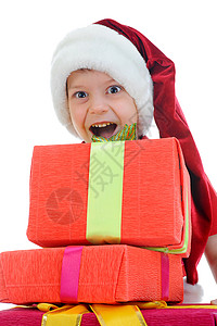 圣诞老人小孩穿着圣诞老人帽子的快乐男孩孤立于白种背景背景