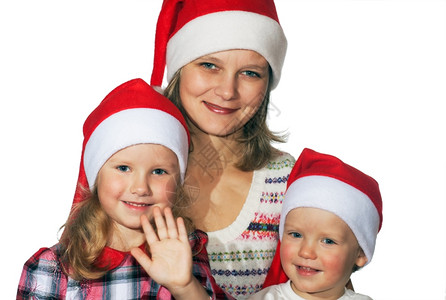 圣诞节前快乐的母亲与小男孩女在轻度背景上不是孤立的图片